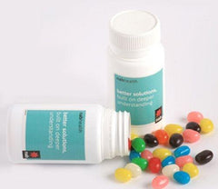 Yum Pill Container filled with lollies